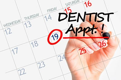 calendar with dentist appointment note on it